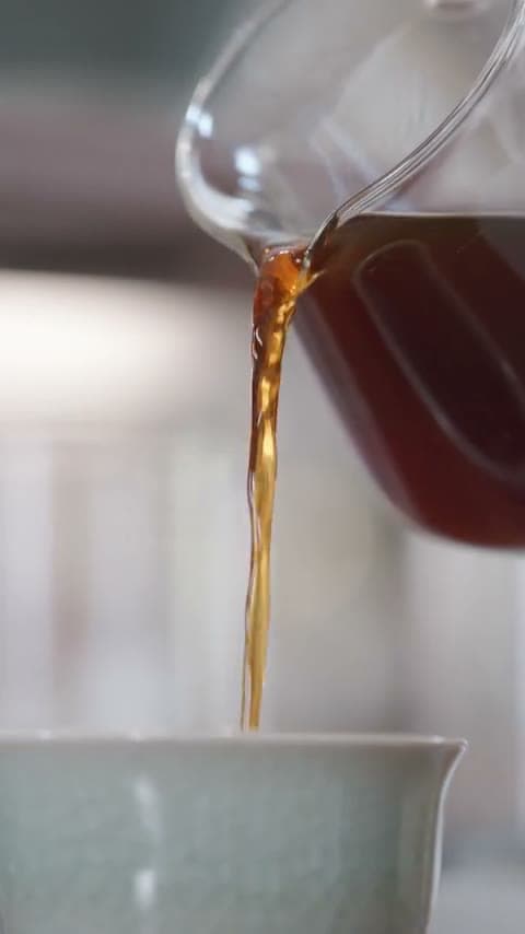 Coffee being poured into a cup